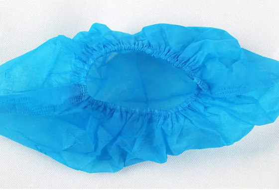 A sapata azul não tecida cobre o anti patim descartável Eco macio amigável